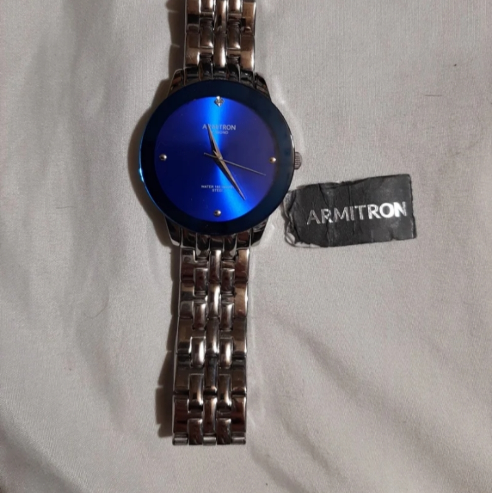Men's blue and silver armatron wrist watch